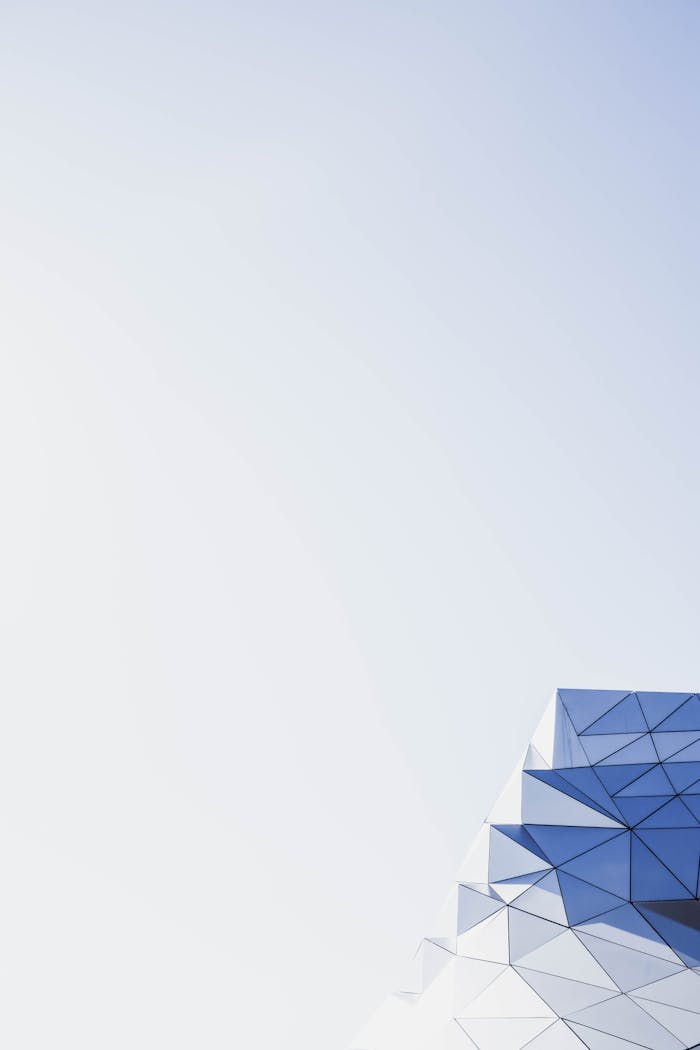 gallery-5 Abstract geometric architecture with clear sky and copy space, perfect for modern design backgrounds.