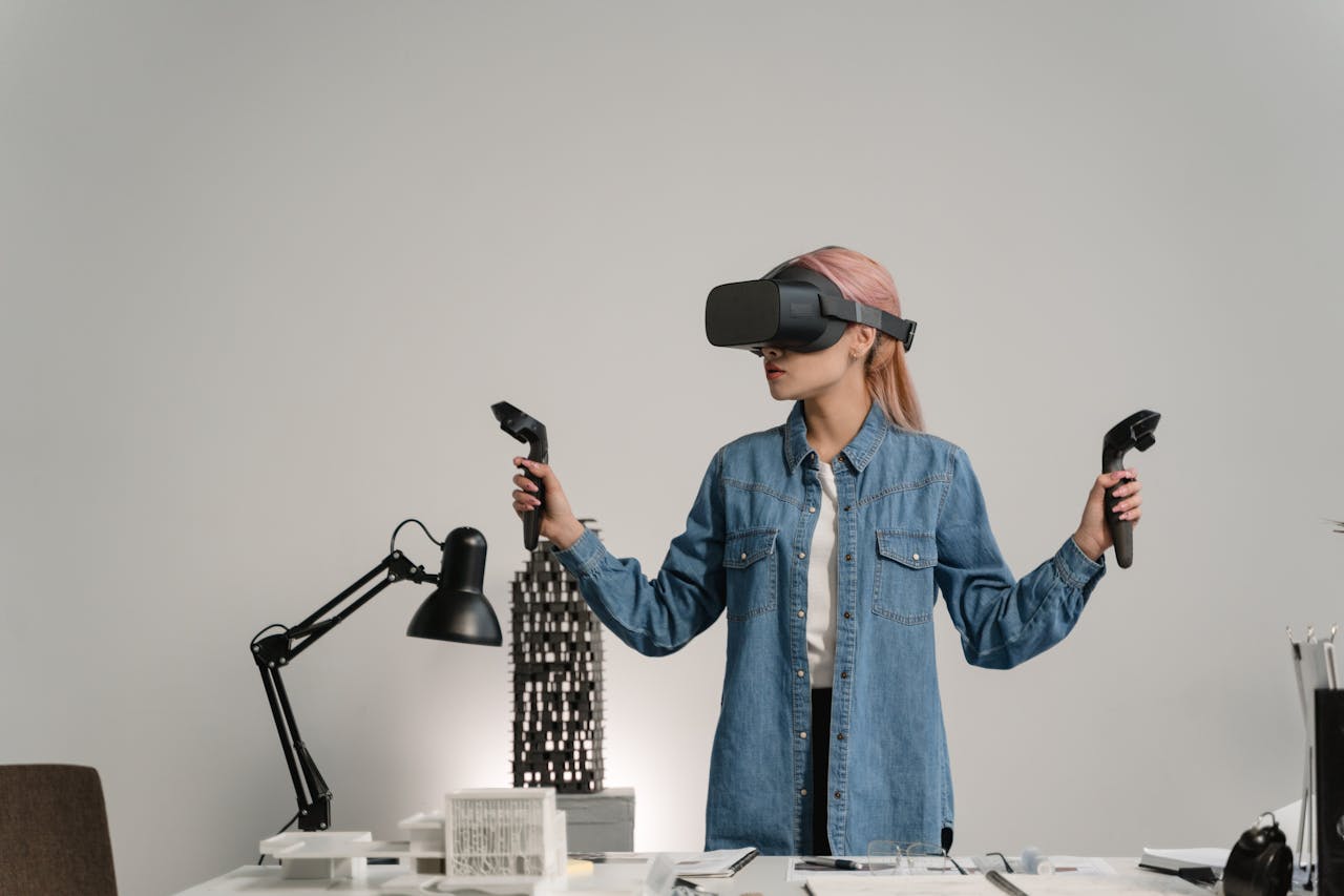 about-01 Young woman using virtual reality for architectural design in a modern office setting.